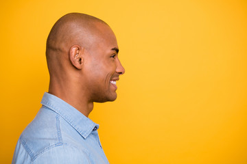 Fototapeta premium Profile photo of dark skin macho attractive appearance white perfect teeth wear jeans denim shirt isolated bright yellow background