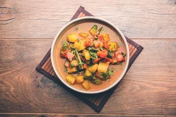Lauki/doodhi ki Sabji also known as bottle gourd curry. served in a bowl or karahi. selective focus