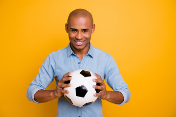 Photo of dark skin guy hold hands ball support favorite team want play wear jeans denim shirt...