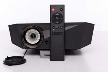 Obraz premium Stylish modern mini LED projektor with remote