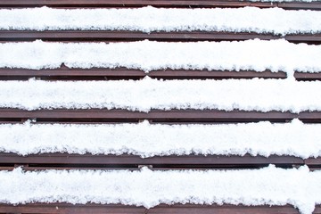 a pattern of a wooden floor covered  with white snow