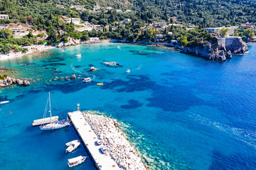 Fototapeta na wymiar Aerial view of beautiful green and rocky island in the blue ocean.
