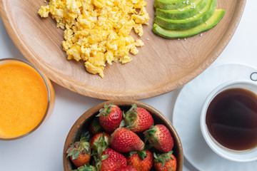 healthy breakfast with eggs and strawberry