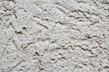 The texture of the facade putty grey walls