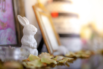 White ceramic doll, rabbit Placed on the dressing table in the dressing room and makeup.soft focus.
