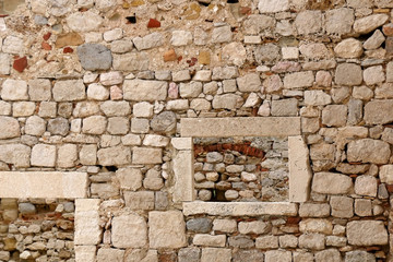 Stone wall ruins in old town Pag, island Pag, Croatia. Selective focus.