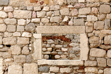 Stone wall ruins in old town Pag, island Pag, Croatia. Selective focus.