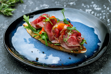 Bruschetta with roast beef on plate