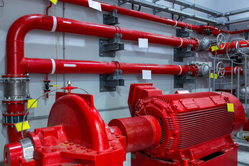Industrial fire pump station. Reliable and trouble-free equipment. Automatic fire extinguishing system control system. Powerful electric water pump, valves, and pipelines for water sprinkler.