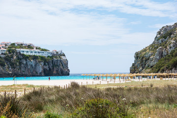 Sunny day at the beach at Cala en Porter, Menorca - obrazy, fototapety, plakaty