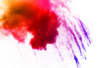 The explosion of colorful holi powder. The cloud of glowing color powder on white background.