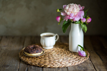 Donuts with fragrant tea. Bakery products. Peonies