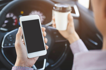people person drinking paper cup coffee of hot in hand while driving in a car in the morning .transportation and vehicle concept.   Leave space for writing text.