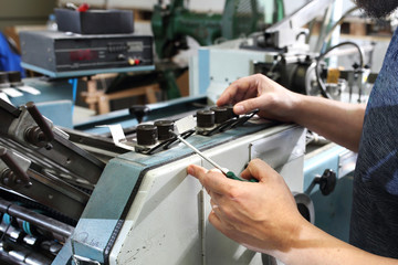 Repair of the printing machine. Machine service, maintenance of the printing machine