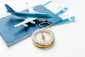 Time to Travel. Idea for tourism with flight tickets and compass on white