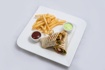 A low contrast Hero shot of a Chicken Pimiento sandwich with samurai & alger sauce & fries on the side, on a minimal white background with a 30 degree angle from diagonal perspective