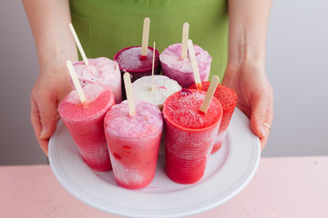 Homemade frozen ice cream popsicles from fruits