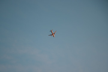 Airplane caching the sunset light 
