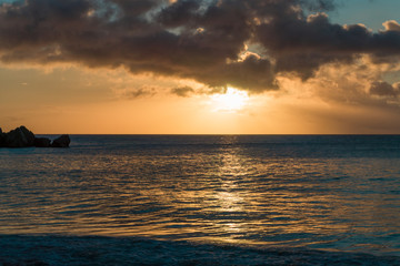 Fototapeta na wymiar Sunset at a sandy beach in Seychelles