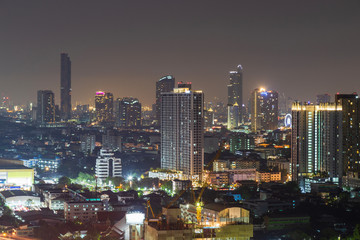 Fototapeta na wymiar Cityscape of building at night.