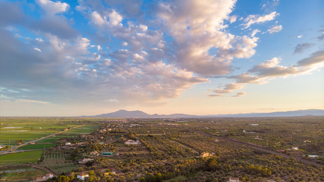 The sunset over L'Ampollaand Deltebre, Catalonia, Spain. Drone aerial photo