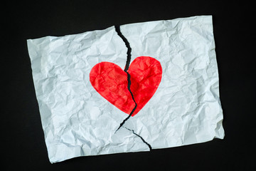 Broken heart, loss, ended relationship or cheating concept. Sign of heart drawn with a marker pen...