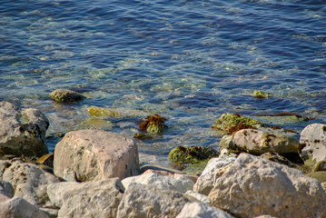 pebble beach with rocks in the water