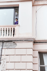 female with short haircut poses in Tbilisi loft