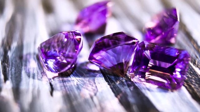 Macro. Jewelry stones. Shining Gems. Transparent purple amethyst. Semiprecious stone