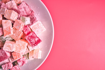Turkish delight. Flavoured Turkish delights on isolated surface