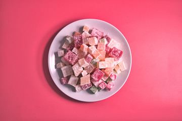 Turkish delight. Flavoured Turkish delights on isolated surface