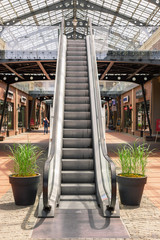 Kiev, Ukraine - July 6, 2019: Escalator Elevator Stairs Lift in Outlet Village called Manufaktura Shoping Center Looks Like Village