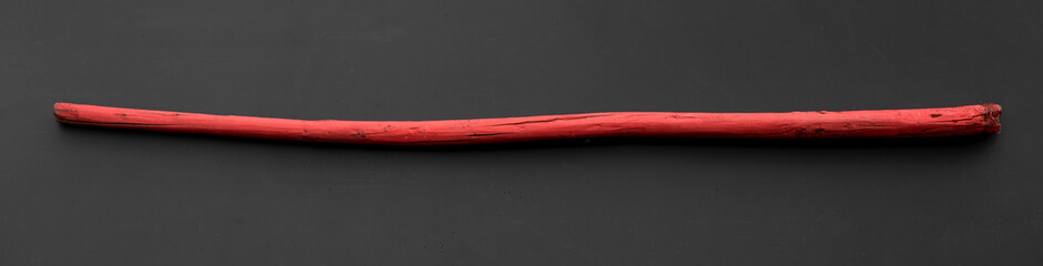 wooden staff isolated on black background