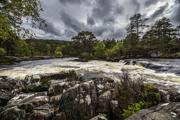 Picturesque landscape of a mountain river with traditional nature of Scotland.