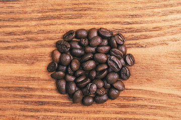 A cup of coffee and scattered coffee beans. Layout. Flat lay. Coffee bean.