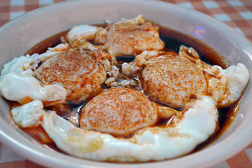 Homemade food - fried eggs in fried red pepper