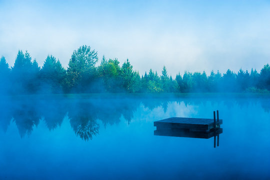 Floating dock on a blue foggy morning, Stowe Vermont, USA