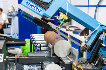 Round shaft steel is being cutting by automatic continuous and high speed horizontal band saw...