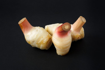 Ingredients for Thai food  Galangal isolated on black background