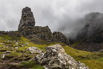 Old Man of Storr on the Isle of Skye in Scotland. Mountain landscape with foggy clouds.