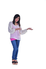 Cheerful business woman showing blank area for sign or copyspase, isolated over white background