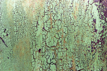 Dark worn rusty metal texture background. Old peeling paint on a metal background.