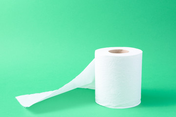 toilet paper isolated in a green background