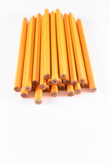 vertical photo of pencils in white