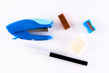 stapler, pen, eraser and pencil sharpener