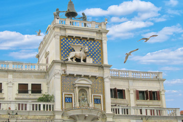 Clock Tower with winged lion and two moors striking the bell in Venice, Italy. Zodiac clock on the...