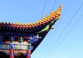 Chinese traditional building eaves closeup day view in blue sky