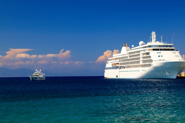 A large white cruise Liner ship stands in the tourist sea port, Rhodes, Greece. Water transport for a travel, recreation. Liner on sea or ocean, summer rest, vacation.