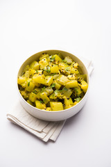 Lauki/doodhi ki sookhi Sabji also known as bottle gourd dry vegetable recipe. served in a bowl or karahi. selective focus