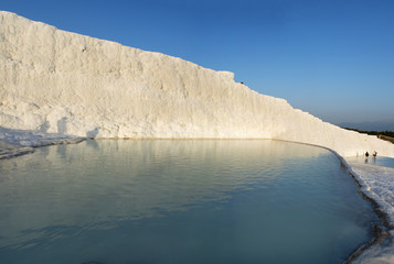 Turkey, the calcium pools on the travertine terraces at Pamukkale (Cotton Castle), natural site of sedimentary rock deposited by hot springs, famous for carbonate mineral left by flowing water